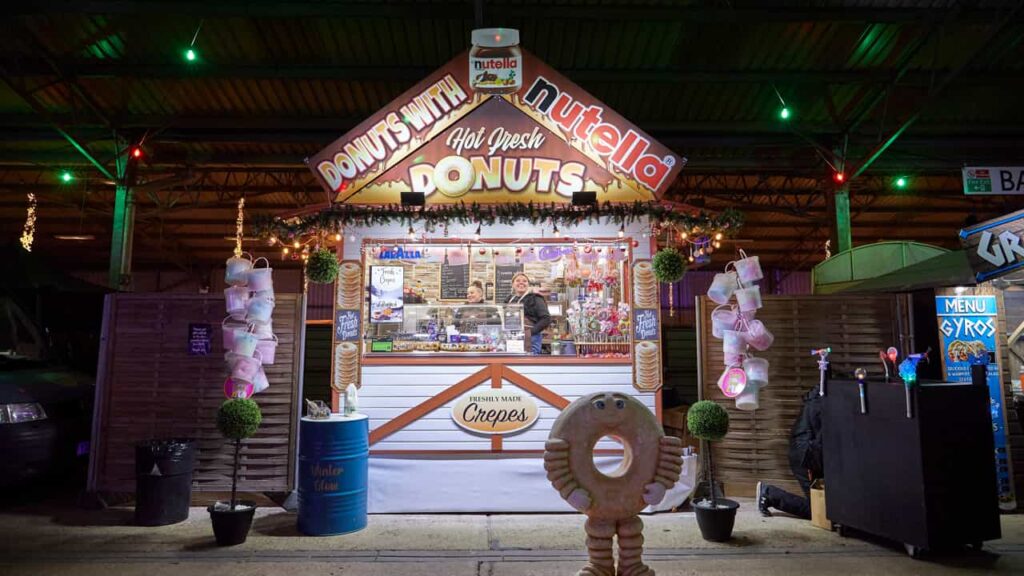 Christmas market stall selling donuts with nutella
