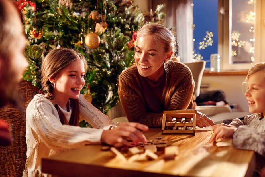 Family Laughing and Playing Games at Christmas